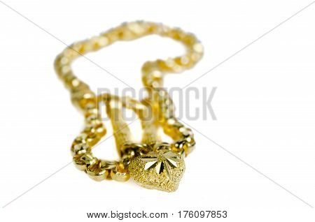 Gold Necklace 96.5 Percent Thai Gold Grade With Gold Heart Pendant Isolated On Red Flannel Cloth Bac