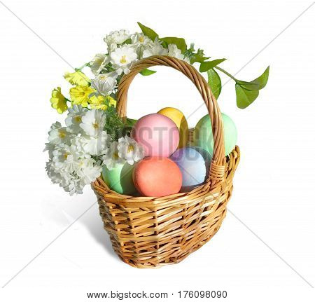 Easter basket with colored eggs and flowers wrapping around the basket handle. Isolated on white.
