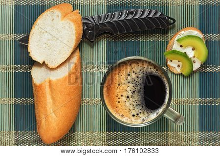 Light brunch with original sandwiches with avocado and coriander made quickly with a jackknife