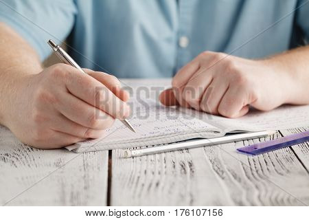 Close Up Male's Hand Writing On Paper, Writing Messy Math, Student Holding Pen Doing Homework At Hom