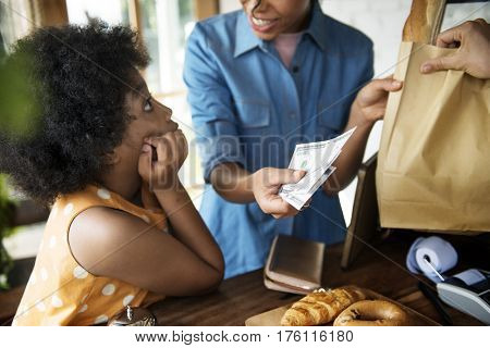 Customer Buying Fresh Baked Bread in Bakery Shop