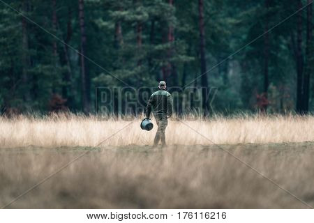 Rangers With Feeding Bucket In Field. National Park Hoge Veluwe.