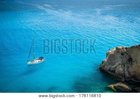 Porto Katsiki beach in Lefkada island, Greece. Luxury yacht on a blue sea.