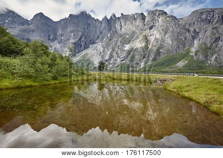 Norway landscape. Troll wall massif mountain Trollveggen. Romsdalen route. Cloudy