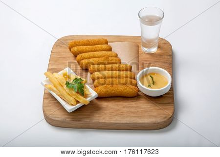Fish Sticks On A Wooden Board.