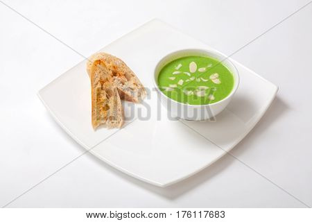 Soup Puree Of Asparagus. Asparagus Cream Soup In White Bowl With Slices Of White Bread