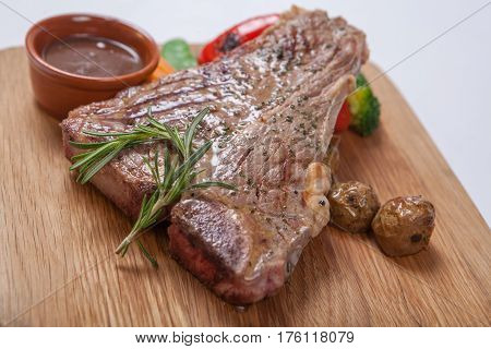 Beef Grilled Medium Rare On A Wooden Board
