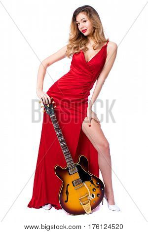 Podolsk, Russia - February 22, 2017: Young brunette Woman with a vintage electric guitar Gibson es-345 1969 model year