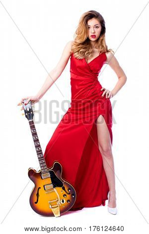 Podolsk, Russia - February 22, 2017: Young brunette Woman with a vintage electric guitar Gibson es-345 1969 model year