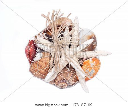 Decorative bag of various seashells from Red Sea isolated on white background