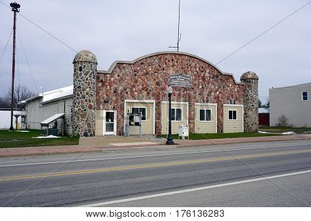 MANCELONA, MICHIGAN / UNITED STATES - NOVEMBER 27, 2016: The Mancelona Village Offices are in an old stone building in downtown Mancelona, together with the Township Ambulance Authority and Allied Emergency Management Services (EMS).