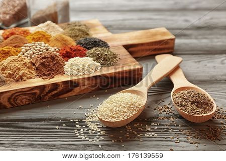 Different spices on wooden table
