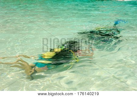 Child Discover Scuba Diving At Cala Mariolu Beach On Sardinia