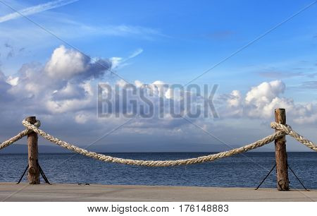 Seafront And Sky With Sunlight Clouds In Autumn Evening