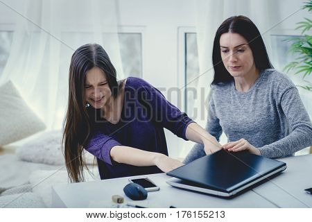 Scared mother arguing daughter over online activity. Cyber bullying or blue whale game concept