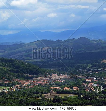 Urbania, Italy - August, 1, 2016: mountain landscape with a view of a small town Urbania in a North Italy