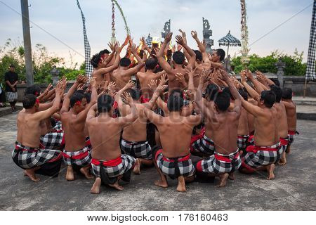 Bali Indonesia - March 03 2013: Kecak dance is a traditional ritual of Bali Indonesia.This dance is being shown at Uluwatu Temple.Blurred appearance of flowing dance.