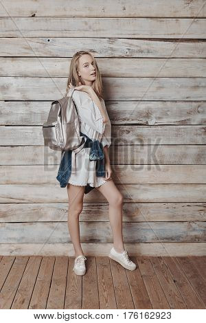 Fashion lifestyle portrait of young pretty woman in wooden room. Processed with VSCO f3 preset