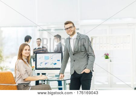 consultant in financial investments and Manager of the company in the workplace in a modern office.the photo has a empty space for your text.