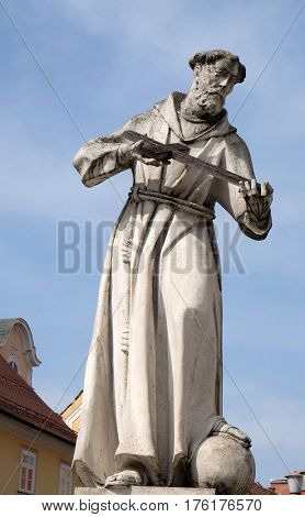MARIBOR, SLOVENIA - APRIL 03: Saint Francis of Assissi statue, Plague column at Main Square of the city of Maribor in Slovenia, Europe. Historical religious sculpture, April 03, 2016.