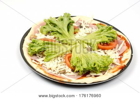 Preparing Pizza With Lettuce And Tomato Over White Background
