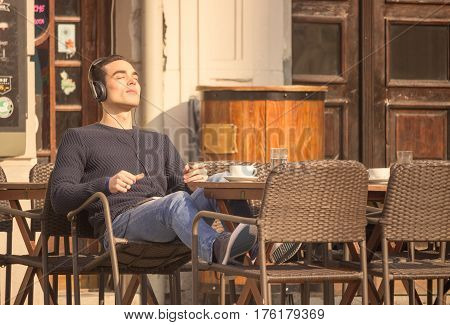 Young Man Headphones Relaxing Enjoying Music Listening