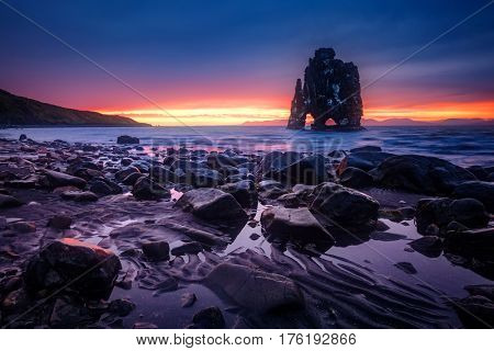 Wonderful dark sand after the tide. Dramatic and gorgeous scene. Location place Hvitserkur, Vatnsnes peninsula, island Iceland, Europe. Popular tourist attraction. Discover the world of beauty.