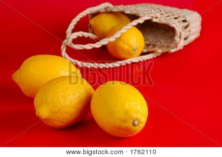 Lemons In A Basket On The Red