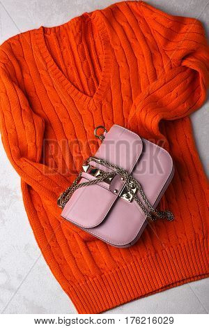Small Womans Leather Pink Bag With Orange Sweater