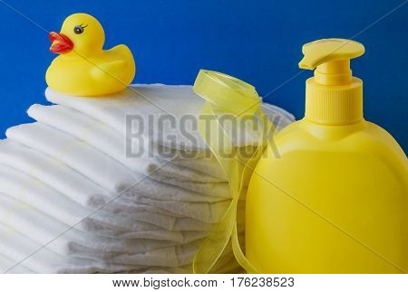 accessories for baby diapers on white background banny a bottle of water cream