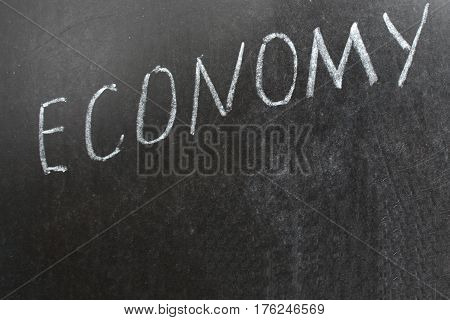 Economics Chalk Board Economy. word Economy written on blackboard