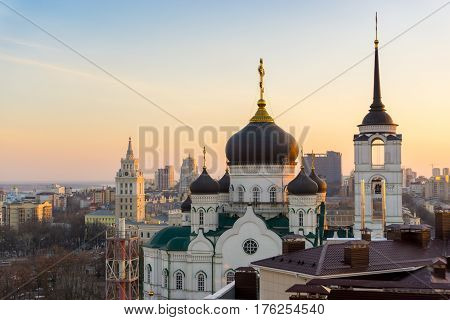 The Annunciation Cathedral (Orthodox Church ) in the center of city at background of South-East Railway Administration Building (RZD), two main symbols of Voronezh city, Russia, sunset time
