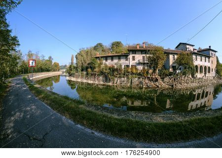 Country house along the Naviglio Grande of Turbigo (Milan Lombardy Italy) at fall. Fisheye