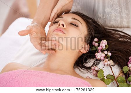 Body and skin care. Pretty woman getting spa treatment at beauty salon enjoying good time