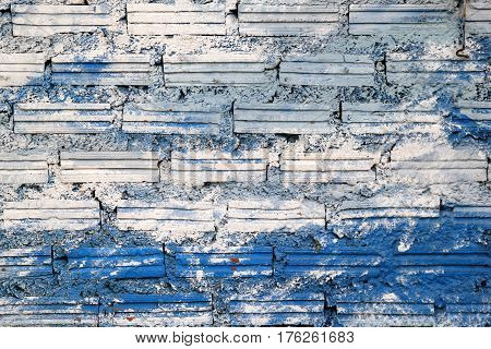 White and blue wall from bricks for background.