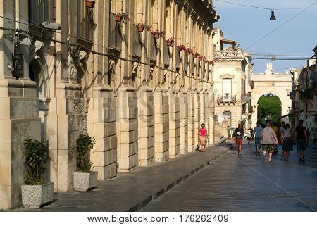 People Walking On An Alley Of Noto