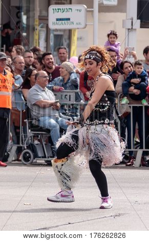 Dancer In Exotic Costume Dances Near The Viewers On Street