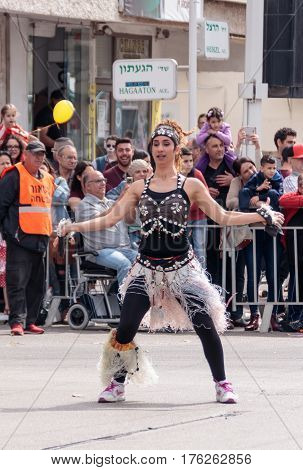 Dancer In Exotic Costume Dances Near The Viewers On Street