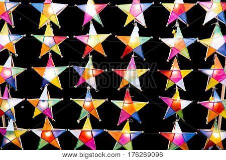Multi colored star lamps and background .