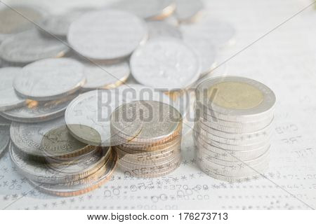 Double exposure of money coins stack for finance and banking concept.
