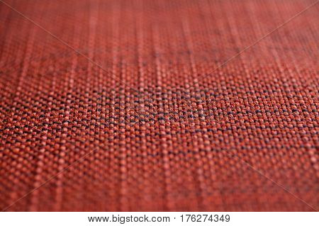 Red and orange fabric texture. Red and orange cloth background. Close up view of multicolor fabric texture and background. Abstract background and texture for designers. Cloth and fabric texture.