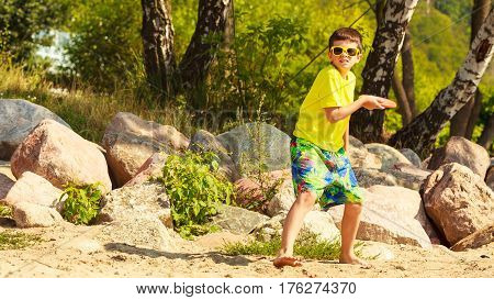 Little Boy Playing With Frisbee Disc.