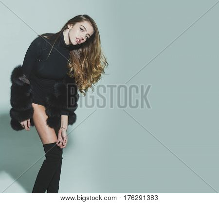 Pretty Sexy Woman With Long Hair In Fur And Jackboot