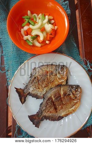 Grilled Pomfret Fish Served With Pickles , Top View