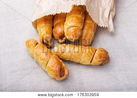 Sausage in the dough close up. Horizontal frame