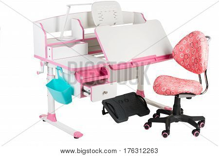 Pink chair pink school table blue basket desk lamp and black support under legs on the white isolated background.