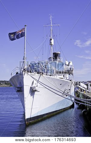 Halifax, Nova Scotia, September 23, 2015 -- Vertical view slightly from the side of a gunship docked in Halifax Harbor on a bright sunny day in September in Halifax, Nova Scotia