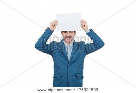 Smiling Young confident businessman holding a white paper over head.