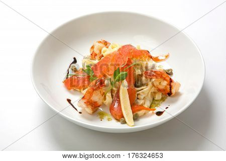 Pasta With Shrimp And Creamy Sauce In A White Deep Dish