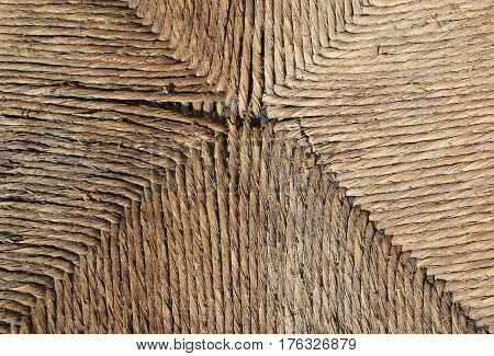 detail of a very old wicker chair of the rural poor